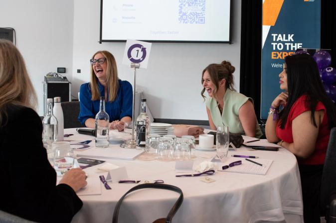 IWD event Carla and member/speaker laughing