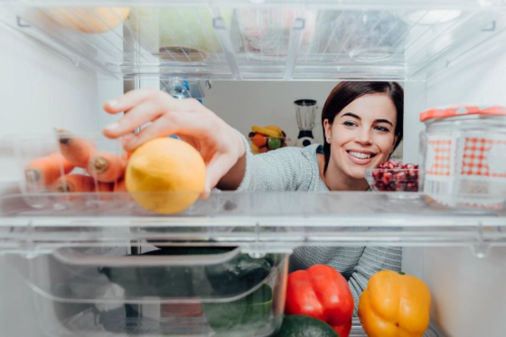 Woman looking in fridge
