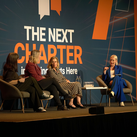 Panel discussion on stage at the UK Housing Conference 2025.